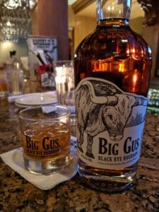 Bottle of big gus black rye bourbon on the bar at Anglos steak house in pcb